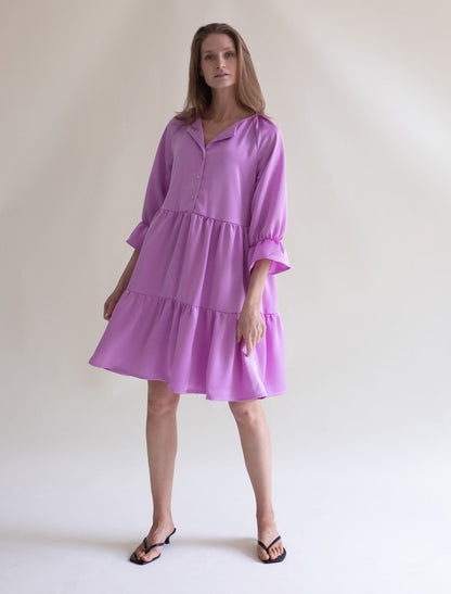 Women’s fuchsia ruffled dress by Gauhar Helsinki, midi length, front view